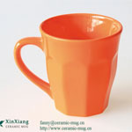 Orange wide mouthed diamond shaped ceramic mugs