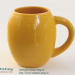 Yellow egg shaped promotional ceramic cup with logo