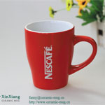 Red circular Nestle ceramic coffee mugs with logo