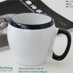 White egg-shaped ceramic breakfast mugs with black rim
