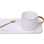 White his ceramic coffee cup and saucer with logo Rectangular plate mug with golden rim and gold handle