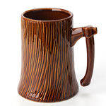 Wholesale color glazed brown creative stump shape ceramic beer mugs with axe handle suppliers